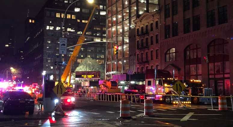NYPD and EMS on the scene in response to a construction accident.